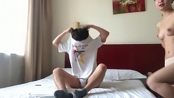 A Pair Of Lovers From China Engaging In Intimate Activities In A Hotel Room